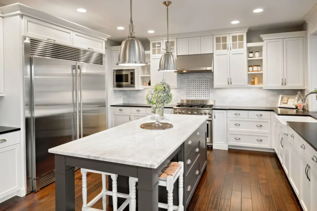 Modern kitchen remodeling with large island and stainless steel appliances